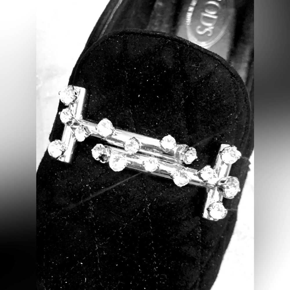 Tod’s elegant velvet loafers are embellished with crystals and hardly worn.